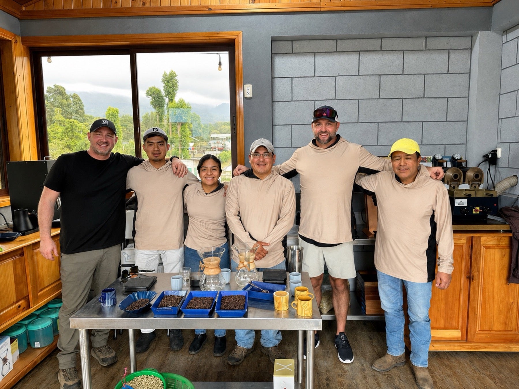 The team cupping coffee together